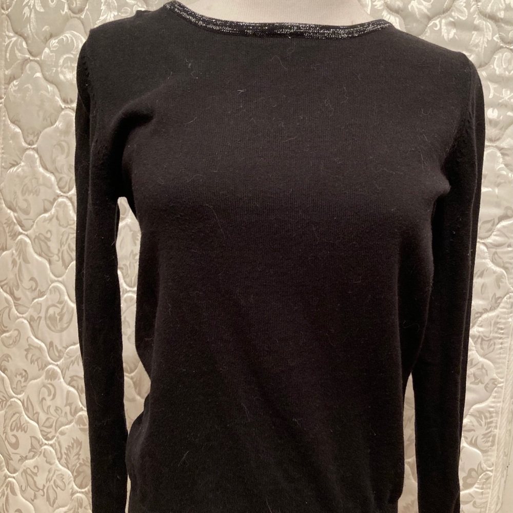 Black sweater with silver glitter bows down back